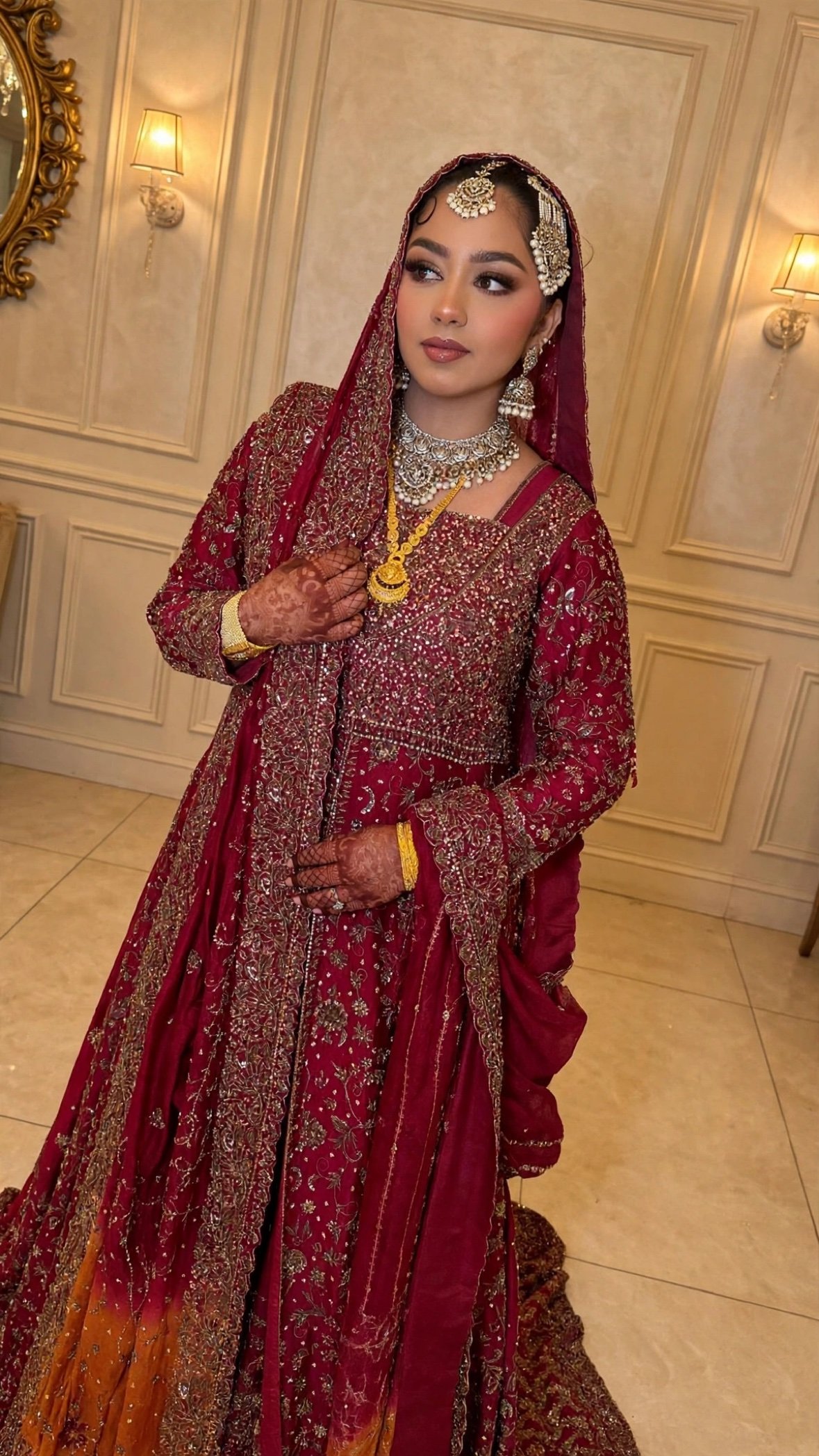 sa glam 03 - Glam By Duaa Bride in a deep red embroidered gown with traditional gold and pearl jewelry and henna